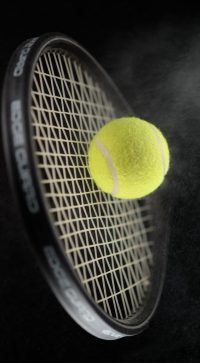A,Shot,Of,A,Tennis,Racket,Hitting,A,Tennis,Ball.