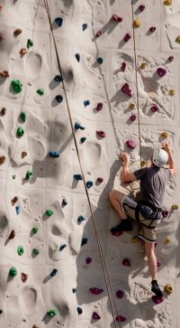 A,Climber,On,A,Rock,Wall,With,Harness,And,Ropes