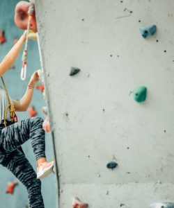 Free,Climber,Young,Woman,Climbing,Artificial,Boulder,Indoors